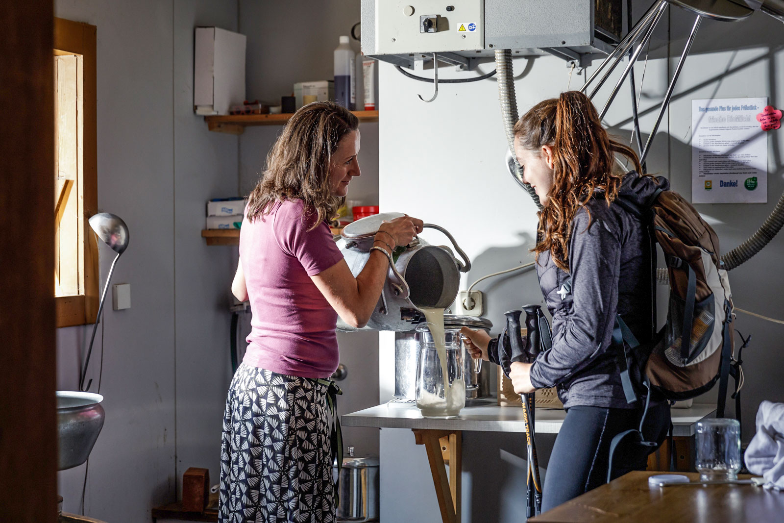 Elisabeth filling fresh milk for guests